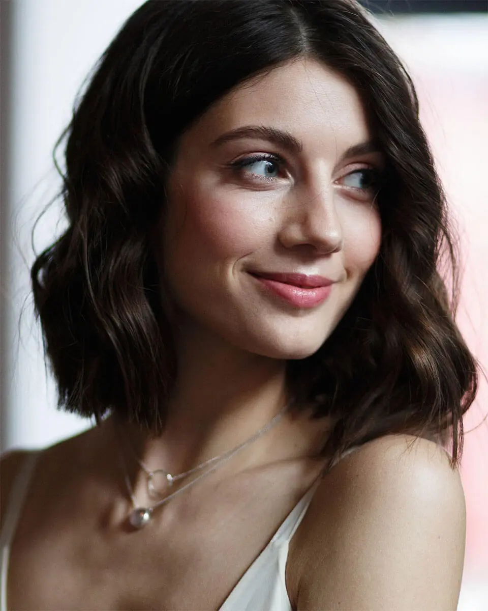 woman smiling looking to the left