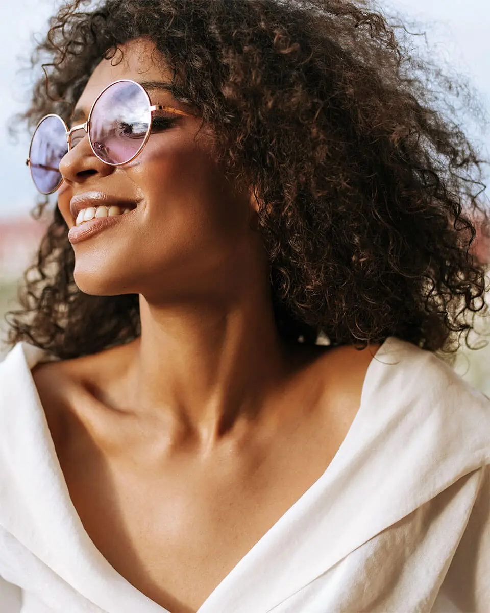 woman smiling wearing glasses