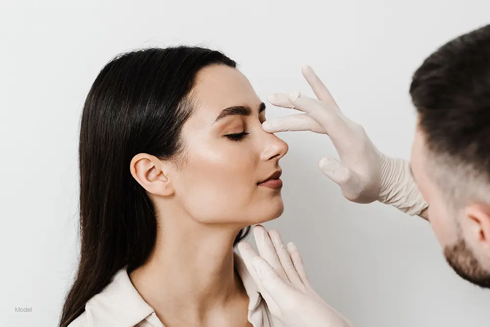 Woman getting her nose examined