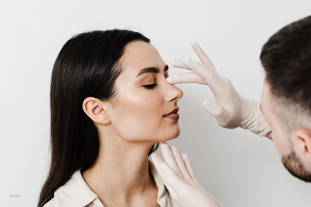 Woman getting her nose examined