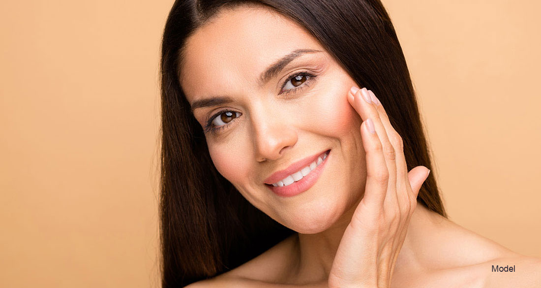 woman touching her face